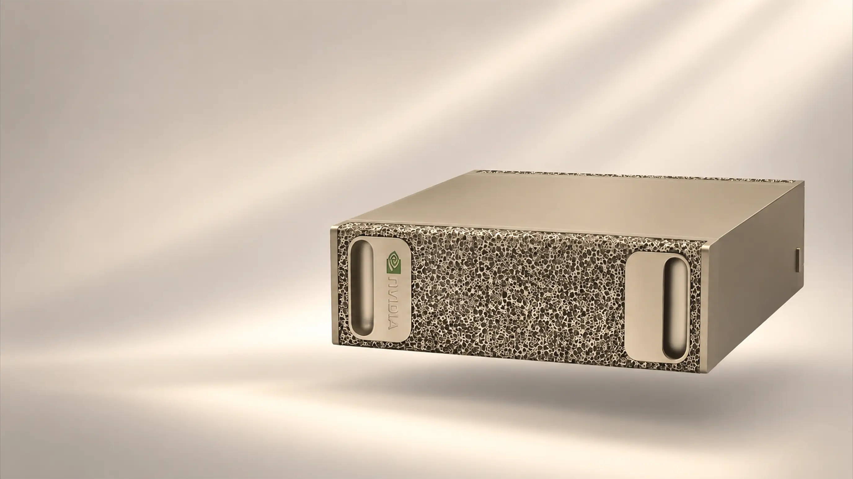 Rendered studio view of a compact, gold-toned computer chassis with a perforated front panel and two handle cutouts, floating against a softly lit backdrop.